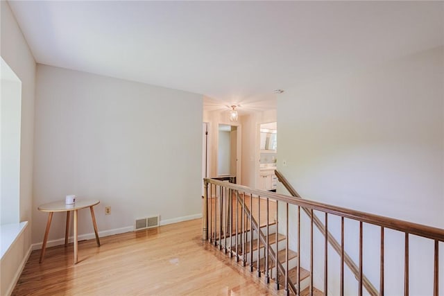 21 Chipping, Perinton, NY 14450 - corridor featuring an upstairs landing and wood finished floors