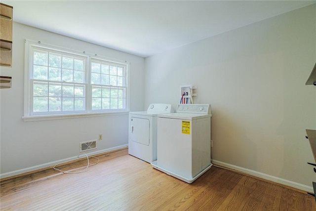 21 Chipping, Perinton, NY 14450 - washroom featuring independent washer and dryer and light wood finished floors