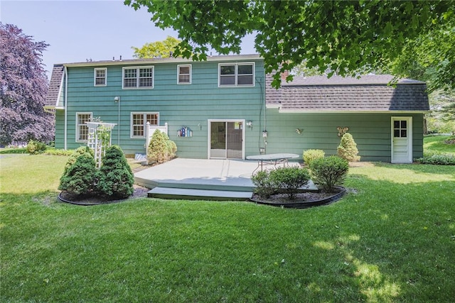 21 Chipping, Perinton, NY 14450 - back of property featuring a lawn, a deck, and roof with shingles