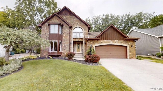 23 Forbes Ct, North Tonawanda, NY 14120 - view of front facade with a garage, driveway, a front yard, board and batten siding, and brick siding
