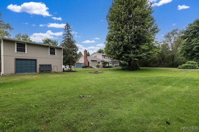 11544 Howe Rd, Newstead, NY 14001 - view of green lawn with a detached garage