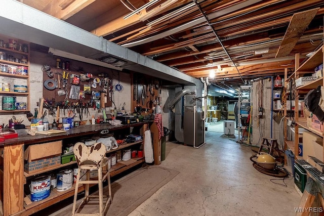11544 Howe Rd, Newstead, NY 14001 - unfinished basement featuring a workshop area and heating unit