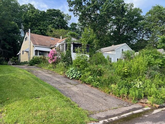 3013 Robins St, Union, NY 13760 - view of front of home with a front lawn and a chimney