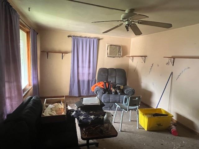 3013 Robins St, Union, NY 13760 - living area with healthy amount of natural light, a ceiling fan, and an AC wall unit