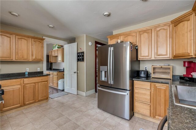 302 N James St, Wilna, NY 13619 - kitchen with stainless steel fridge with ice dispenser and dark stone countertops