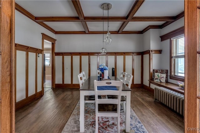 302 N James St, Wilna, NY 13619 - dining space with radiator heating unit, coffered ceiling, wood finished floors, and beam ceiling