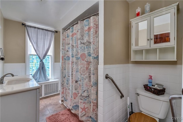 302 N James St, Wilna, NY 13619 - bathroom with tile walls, vanity, tile patterned floors, wainscoting, and a shower with shower curtain