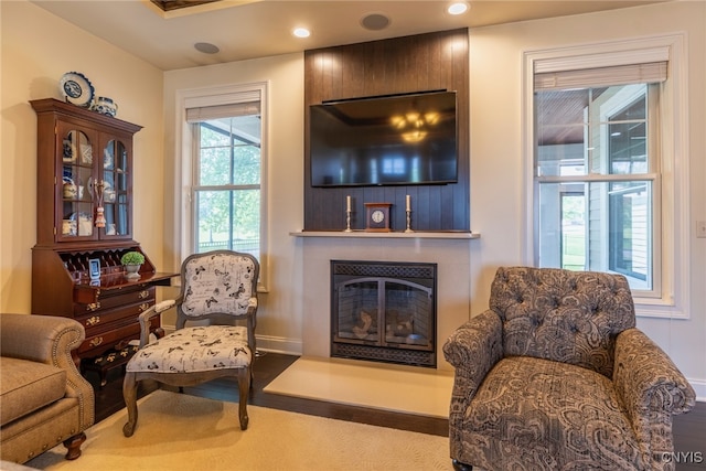 3389 Long Shadow Dr, Lysander, NY 13027 - sitting room with a glass covered fireplace, wood finished floors, and recessed lighting