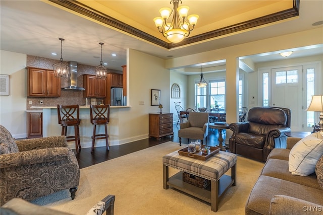 3389 Long Shadow Dr, Lysander, NY 13027 - living room with a chandelier, ornamental molding, recessed lighting, wood finished floors, and a raised ceiling
