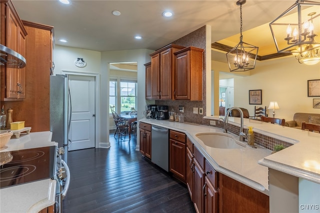 3389 Long Shadow Dr, Lysander, NY 13027 - kitchen featuring stainless steel appliances, a chandelier, light countertops, recessed lighting, and dark wood-type flooring