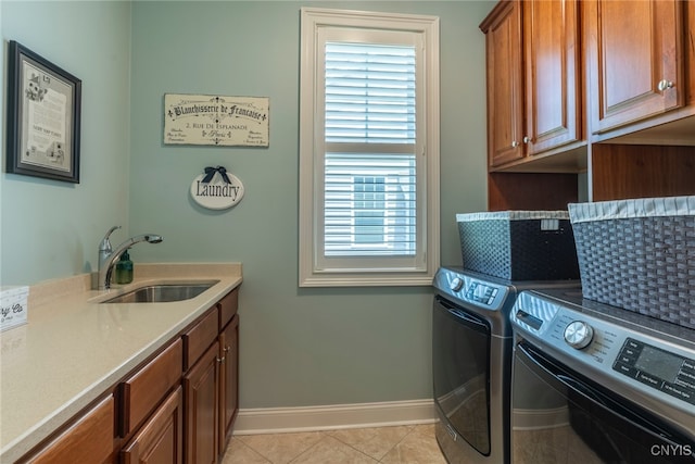 3389 Long Shadow Dr, Lysander, NY 13027 - laundry room featuring washer and clothes dryer, cabinet space, and light tile patterned floors