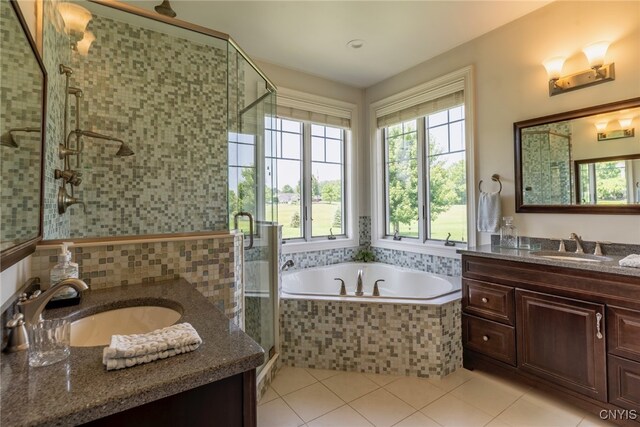3389 Long Shadow Dr, Lysander, NY 13027 - bathroom with two vanities, a garden tub, a shower stall, tile patterned floors, and recessed lighting