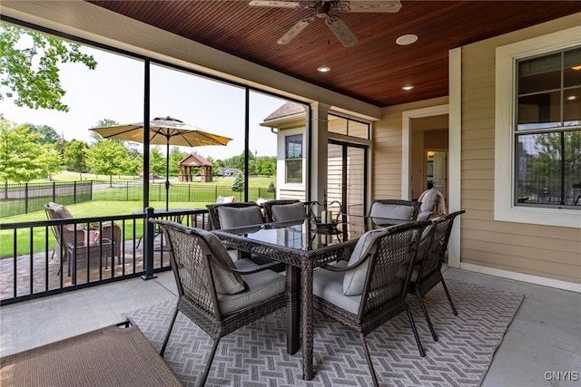 3389 Long Shadow Dr, Lysander, NY 13027 - sunroom with outdoor dining space, ceiling fan, and plenty of natural light