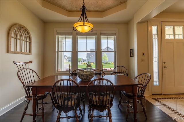 3389 Long Shadow Dr, Lysander, NY 13027 - dining space featuring a raised ceiling and baseboards