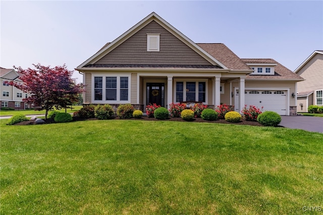 3389 Long Shadow Dr, Lysander, NY 13027 - craftsman inspired home with a front yard, asphalt driveway, a garage, and stone siding