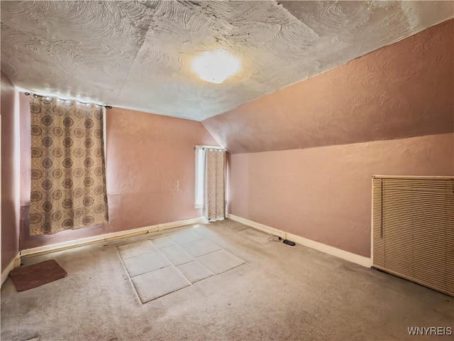 69 Halstead Ave, Cheektowaga, NY 14212 - bonus room featuring carpet flooring, vaulted ceiling, a textured ceiling, and a textured wall