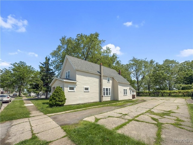 69 Halstead Ave, Cheektowaga, NY 14212 - view of property exterior featuring a chimney