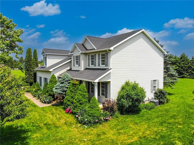 106 Woodsview, Erwin, NY 14870 - view of side of home featuring a shingled roof and a lawn