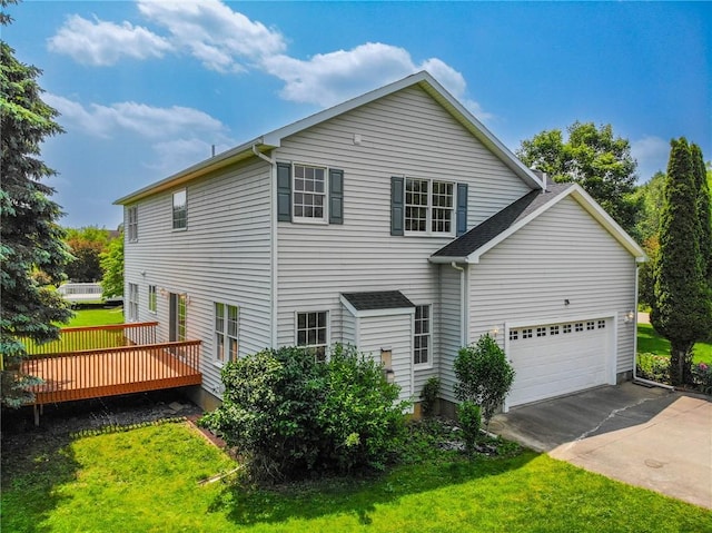 106 Woodsview, Erwin, NY 14870 - back of property featuring a garage, a wooden deck, driveway, and a yard