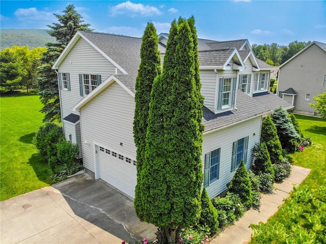 106 Woodsview, Erwin, NY 14870 - view of home's exterior with an attached garage, a yard, concrete driveway, and a shingled roof