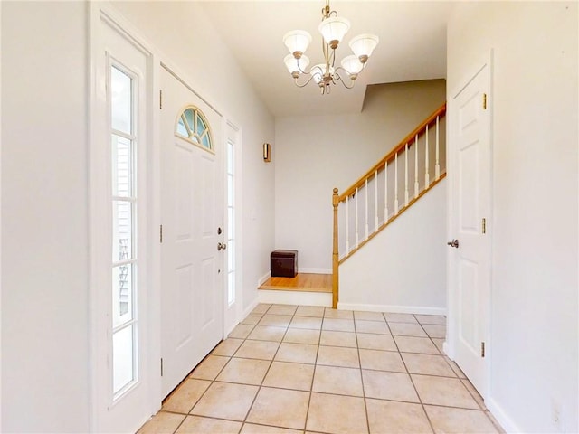 106 Woodsview, Erwin, NY 14870 - entrance foyer featuring stairway, a chandelier, and light tile patterned floors