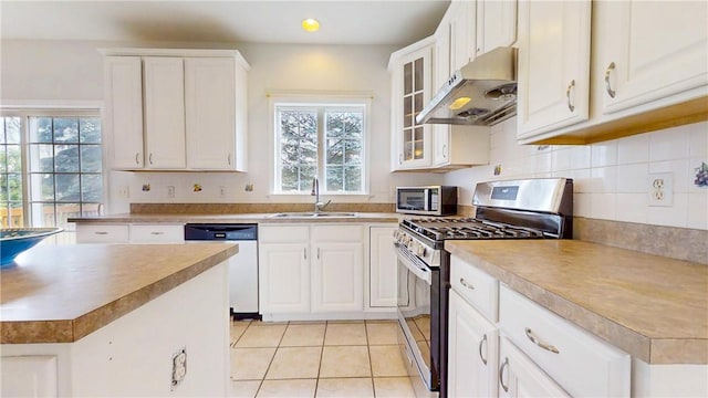 106 Woodsview, Erwin, NY 14870 - kitchen with appliances with stainless steel finishes, under cabinet range hood, healthy amount of natural light, white cabinetry, and recessed lighting