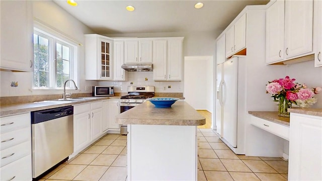 106 Woodsview, Erwin, NY 14870 - kitchen featuring stainless steel appliances, under cabinet range hood, a center island, white cabinetry, and recessed lighting
