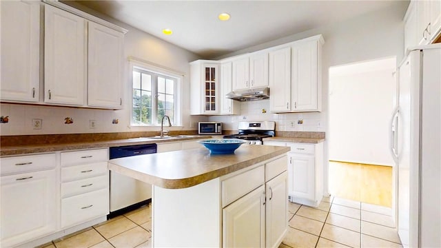 106 Woodsview, Erwin, NY 14870 - kitchen with stainless steel appliances, under cabinet range hood, light tile patterned floors, white cabinetry, and recessed lighting