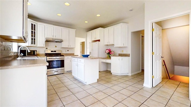 106 Woodsview, Erwin, NY 14870 - kitchen featuring stainless steel gas stove, under cabinet range hood, white fridge with ice dispenser, light countertops, and white cabinetry