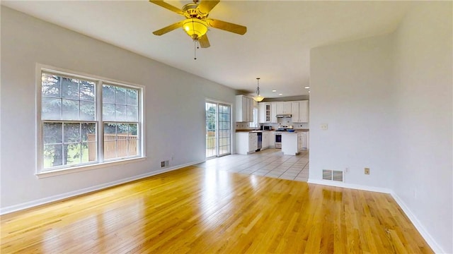 106 Woodsview, Erwin, NY 14870 - unfurnished living room featuring light wood-style flooring, a ceiling fan, and recessed lighting