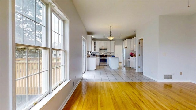 106 Woodsview, Erwin, NY 14870 - unfurnished living room featuring light wood finished floors and recessed lighting