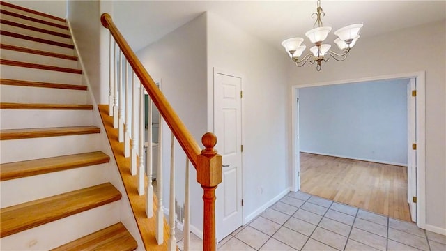 106 Woodsview, Erwin, NY 14870 - staircase with a chandelier and tile patterned floors