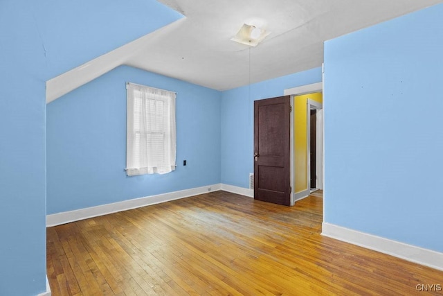 500 Glenwood Ave, Syracuse, NY 13207 - unfurnished room with hardwood / wood-style flooring and vaulted ceiling