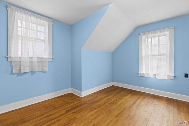 500 Glenwood Ave, Syracuse, NY 13207 - additional living space featuring healthy amount of natural light, hardwood / wood-style flooring, and vaulted ceiling