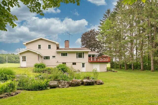 4581 Nelson Rd, Fenner, NY 13035 - back of property with a lawn, a wooden deck, and a chimney