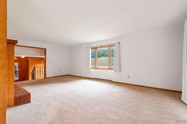4581 Nelson Rd, Fenner, NY 13035 - carpeted spare room with baseboards and a baseboard heating unit