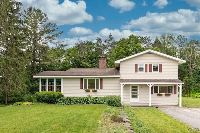 4581 Nelson Rd, Fenner, NY 13035 - tri-level home featuring a front yard, a chimney, a porch, and a shingled roof