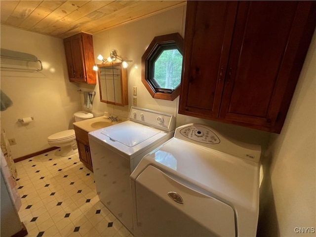 8054 Sand Pond Rd, Greig, NY 13343 - washroom featuring separate washer and dryer, wooden ceiling, and light floors