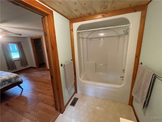 8054 Sand Pond Rd, Greig, NY 13343 - bathroom featuring shower / washtub combination, wood finished floors, and ceiling fan