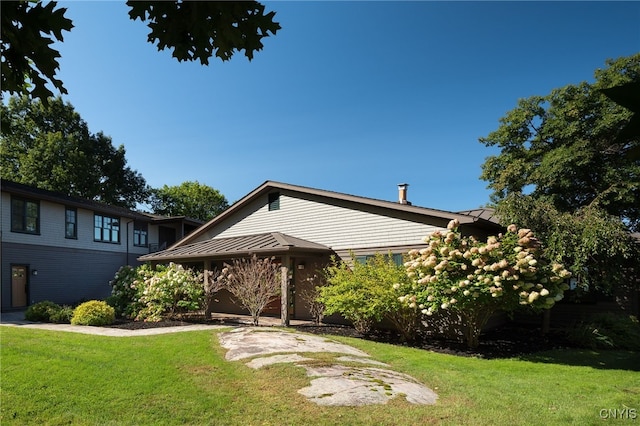 23986 Smith Rd, Alexandria, NY 13607 - view of front facade with a front lawn, a standing seam roof, and a metal roof