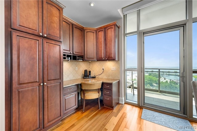 132 Lakefront Blvd Unit 804, Buffalo, NY 14202 - home office featuring built in study area, light wood-type flooring, and a water view