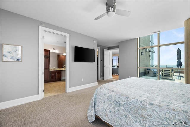 132 Lakefront Blvd Unit 804, Buffalo, NY 14202 - bedroom with light colored carpet, ensuite bath, and light tile patterned floors