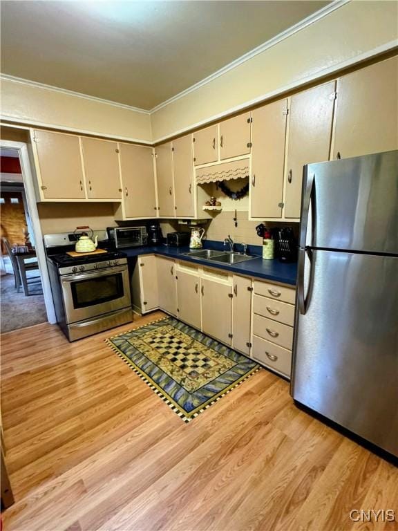 373 S Collingwood Ave, Syracuse, NY 13206 - kitchen with appliances with stainless steel finishes, crown molding, light wood-style flooring, and dark countertops