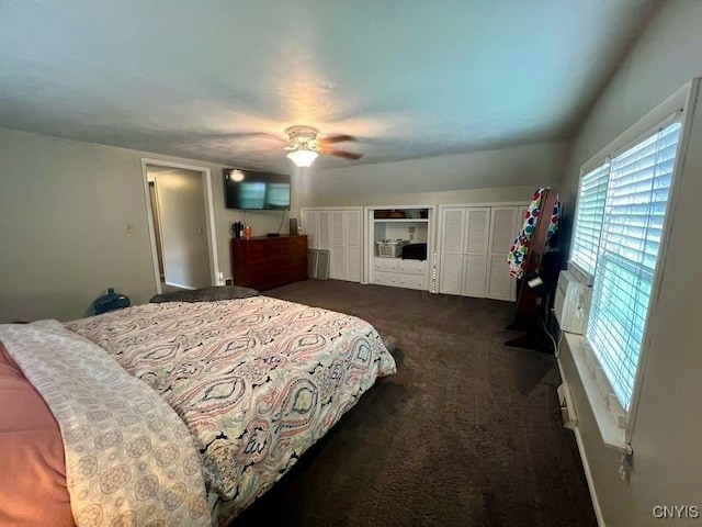 60 Cambridge Rd, Whitestown, NY 13492 - bedroom featuring dark carpet, two closets, and a ceiling fan