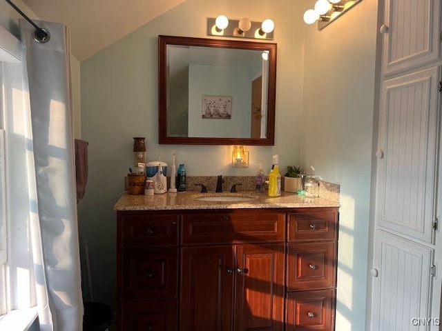 60 Cambridge Rd, Whitestown, NY 13492 - bathroom with vanity and lofted ceiling