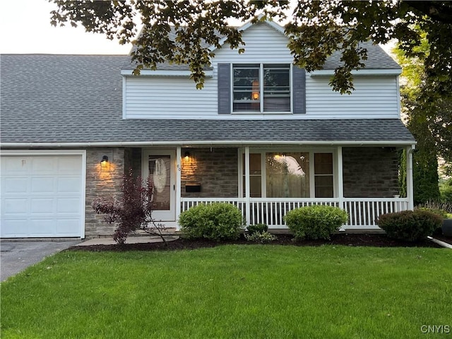 60 Cambridge Rd, Whitestown, NY 13492 - traditional-style home with a porch, a shingled roof, a front yard, stone siding, and an attached garage