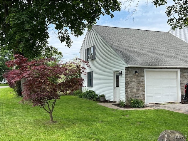 60 Cambridge Rd, Whitestown, NY 13492 - view of side of property featuring a shingled roof, stone siding, a yard, and asphalt driveway
