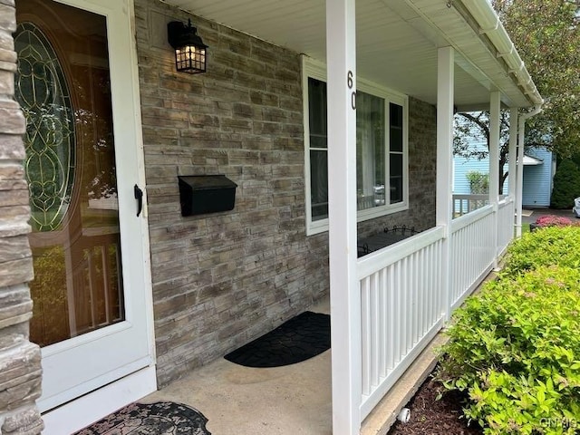 60 Cambridge Rd, Whitestown, NY 13492 - view of exterior entry featuring covered porch