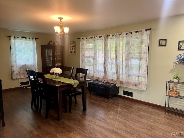 60 Cambridge Rd, Whitestown, NY 13492 - dining room featuring plenty of natural light, dark wood-type flooring, and a chandelier
