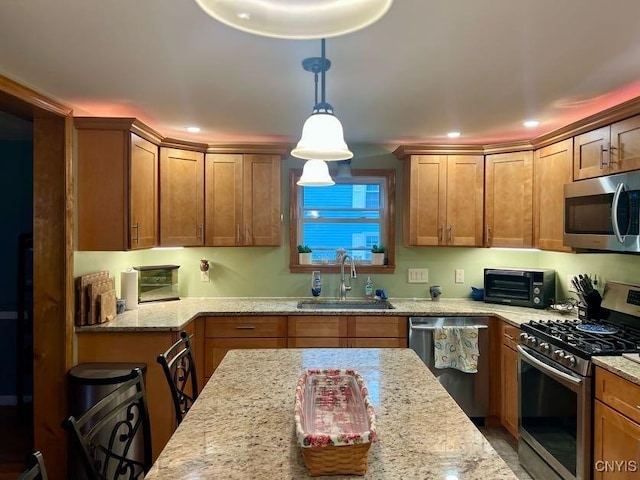 60 Cambridge Rd, Whitestown, NY 13492 - kitchen featuring stainless steel appliances, hanging light fixtures, light stone counters, recessed lighting, and brown cabinets